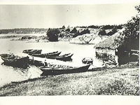 Fiskebåtar och sjöbodar med båthus vid Griskär 1909