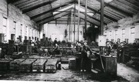 Arbetare i en fabrik